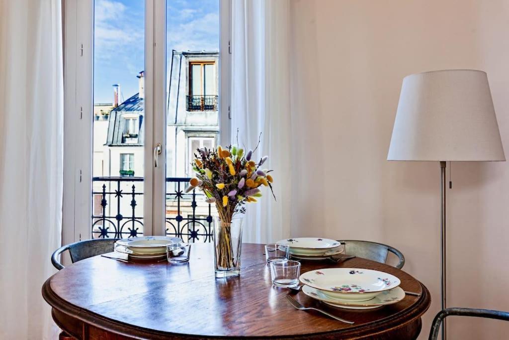 Charmant Appartement Au Coeur De パリ エクステリア 写真