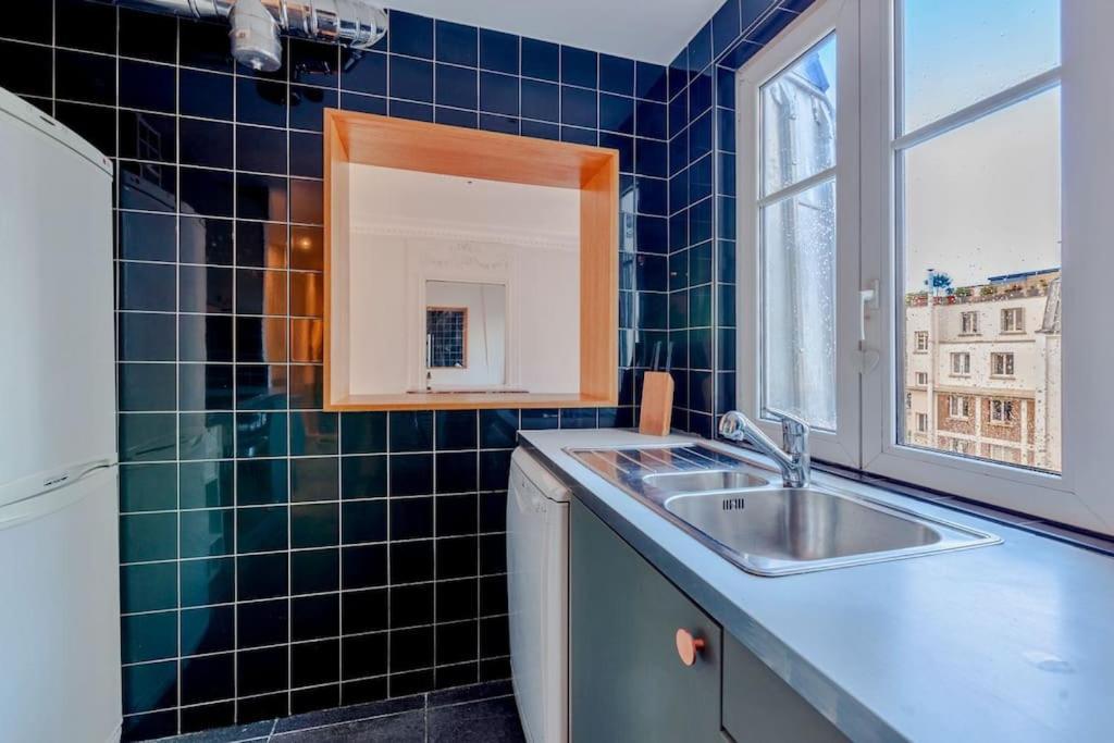 Charmant Appartement Au Coeur De パリ エクステリア 写真